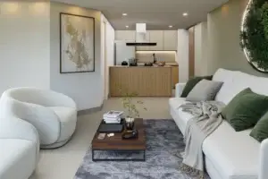 Sala y cocina de apartamento modelo en Velona, con diseño sofisticado y acabados premium. Muestra la armonía entre áreas sociales, perfecta para un estilo de vida exclusivo en apartamentos exclusivos en La Estrella, Antioquia.