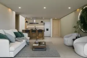Perspectiva amplia del área social y cocina con diseño funcional de los apartamentos exclusivos en La Estrella, Antioquia. Resalta la arquitectura contemporánea y la fluidez del espacio.