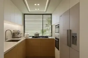 Cocina con acabados premium y diseño en U en los apartamentos exclusivos en La Estrella, Antioquia. Resalta el diseño funcional que optimiza el espacio y la luz.